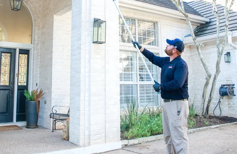 Tech sweeping exterior of home